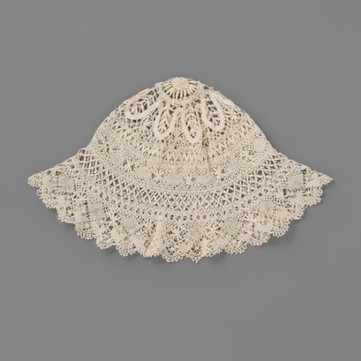 Cap of Cluny lace with a pattern of a daisy with radiating leaves