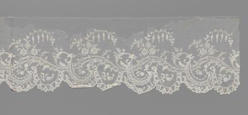 Strip of appliqué lace with wavy vine and bellflower branches