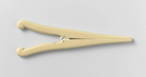 Glove stretcher of bone or plastic, unadorned, with inwardly curved handles