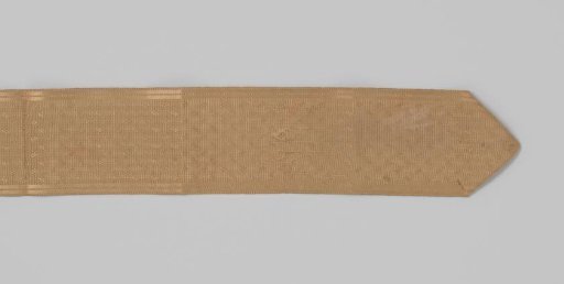 Belt ribbon of gold-colored silk damask, with a taffeta ground and a checkered pattern of scattered motifs