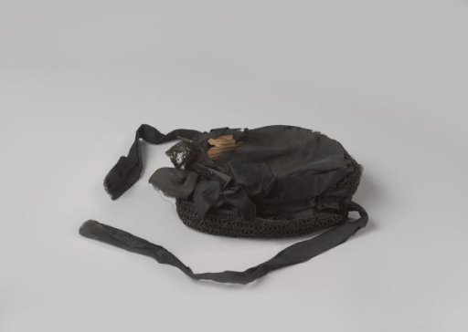 Hat of black taffeta with a border of beads and a bow
