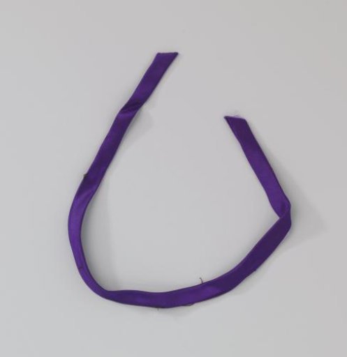 Purple satin ribbon; belonging to two other fabric fragments of a purple gala gown