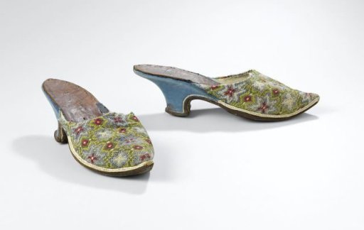Slipper with embroidered silk upper on a foundation, with a pattern of blue starflowers on a yellow ground with green netting and red squares and white dots