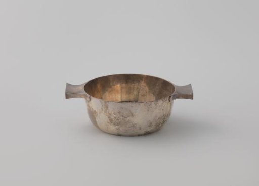 Silver bowl, round, with a convex vaulted wall widening towards the rim, with two horizontal handles along the upper edge.