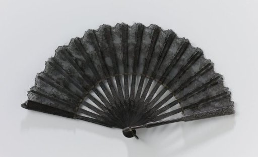 Folding fan with black silk leaf featuring an appliqué of black lace, on a black-painted wooden mount