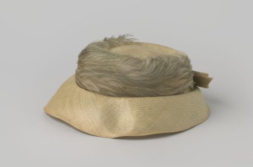 Hat of soft green straw, with feathers in a slightly darker shade of grey-green