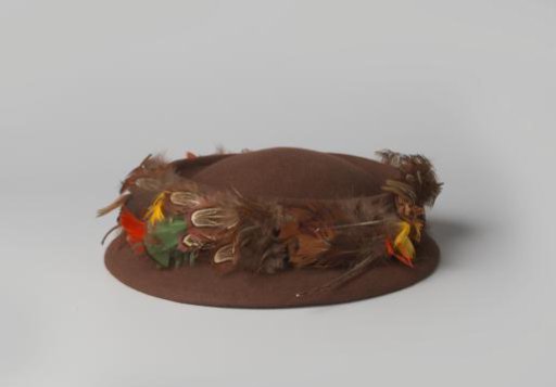 Hat of brown felt with orange, yellow, green and beige feathers