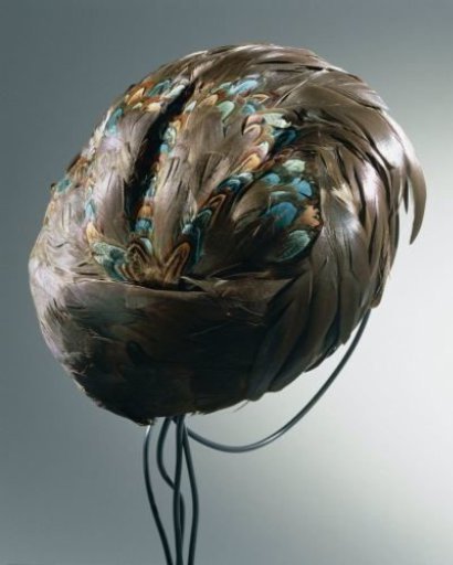 Hat covered with rooster feathers in turban shape