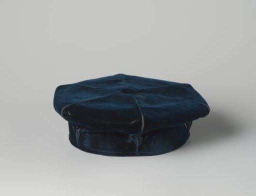 Professor's barret of dark blue silk velvet, with a black leather headband and lined with black satin