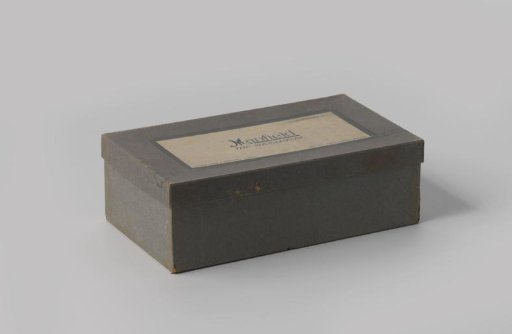 Shoebox containing a pair of evening shoes