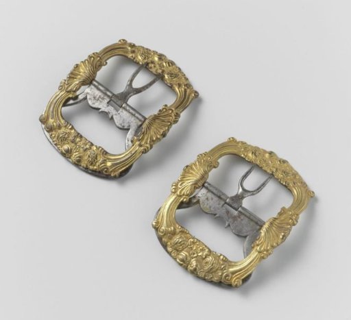 Gilt copper shoe buckle (?), decorated in relief with shell and fruit
