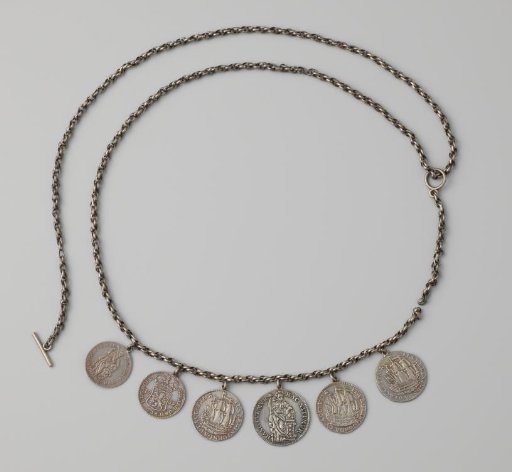 Necklace with six coins in a box