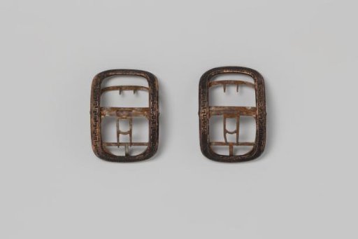 Rectangular and Curved Shoe Buckle of Gilded Copper, Decorated with a Meander, Relief Chased on a Black Ground