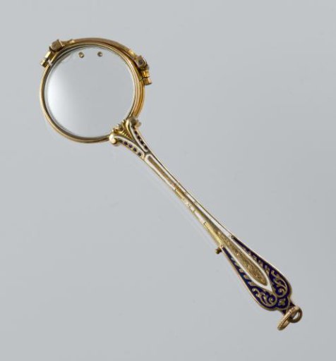 Hand mirror with frame of gilded copper with white and dark blue enamel
