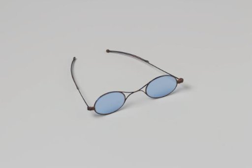 Spectacles of blue steel with oval blue lenses