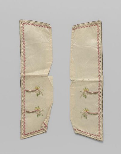 Cuff with false buttonholes of white taffeta, with embroidered pearl border and pink shells