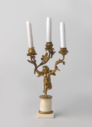 Candelabrum of white marble and gilded bronze, with three arms in the form of branches with leaves, ending in rosebuds, supported by winged putti.