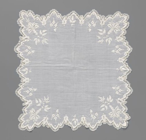 Handkerchief with embroidery and triangular shells with blooming lilies in the corners, finished around with a border of bobbin lace
