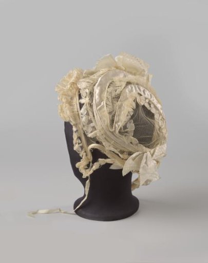 Hat of tulle and white satin, decorated with tulle stuffing and ribbon; model with round crown