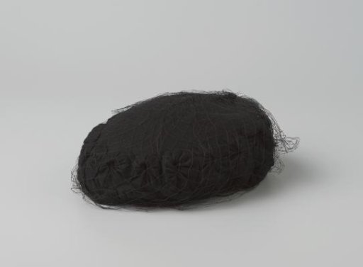 Hat of black felt, with veil