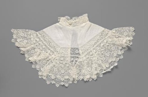 Collar of batiste with inserts of machine-made lace and finished around with a wide border of machine-made lace