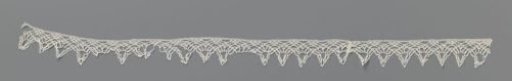 Strip of bobbin lace with elongated triangular shells and fans