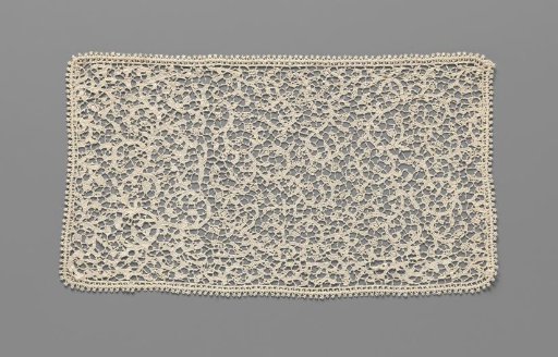 Strip of needle lace with spiral scrolls fashioned into a small cloth