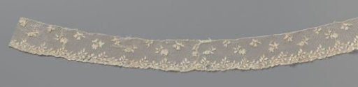Strip of needle lace with wavy leaf vine