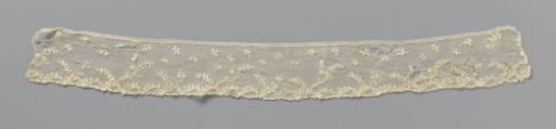Strip of needle lace with wavy leaf vine