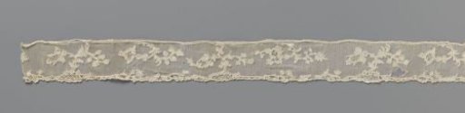 Strip of needle lace with four different split flower branches