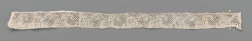 Strip of bobbin lace with a one-sided S-shaped flower stem with a cup flower
