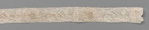 Strip of bobbin lace with carnation on curved stem and broad S-shaped leaf