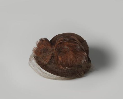 Hat of dark brown velvet with feathers and tulle