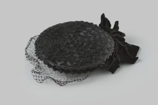 Hat of coarse black straw, with a black velvet bow