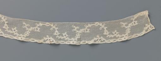 Strip of bobbin lace with a continuous wavy vine with berries and a butterfly