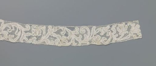Strip of needle lace with various flowers