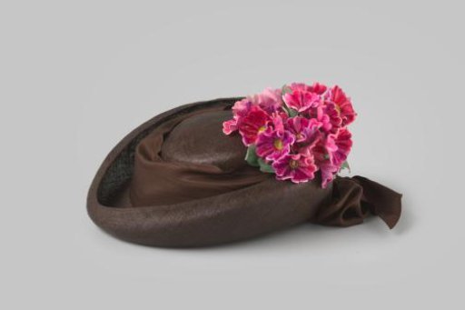 Hat of brown straw with velvet flower corsage