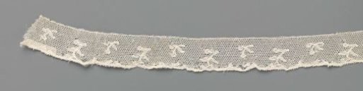 Strip of bobbin lace with hanging branches