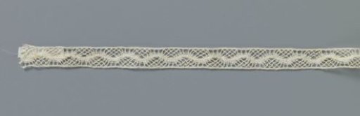Insert of machine-made lace with wavy line