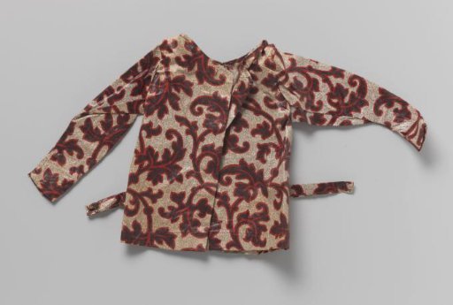 Children's cape of chintz with a white ground with blue leaves edged in red, circular model with standing collar