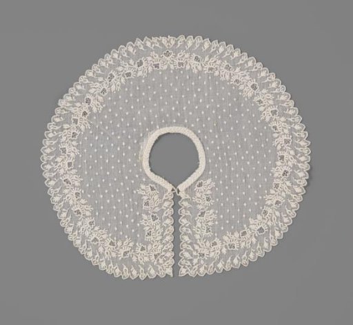 Children's collar of batiste, edged with a scalloped border and decorated with white work in the form of floral and leafy scrolls and rosettes
