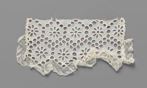 Cuff of batiste with connected hexagons containing marguerites of lace embroidery and finished on three sides with a strip of machine lace
