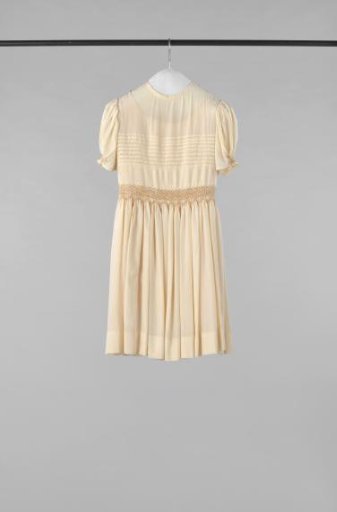 Children's Dress with Short Puffed Sleeves and Back Fastening with Two Mother-of-Pearl Buttons of Cream Thin Silk, Decorated with Tucks and Smocking