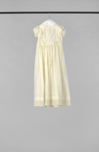 Summer dress of linen for a girl, with machine embroidery strips