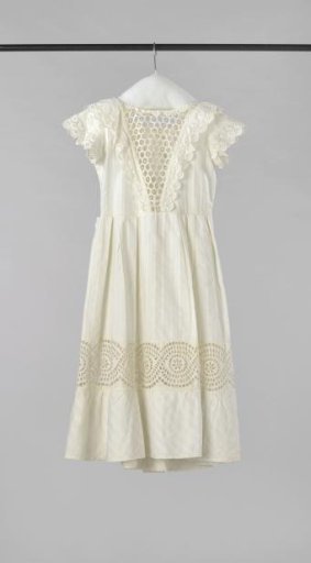 Girl's dress of white cotton with woven straight and diagonal stripes, between which horizontal ribs, with openwork inserts and scalloped edges of English embroidery