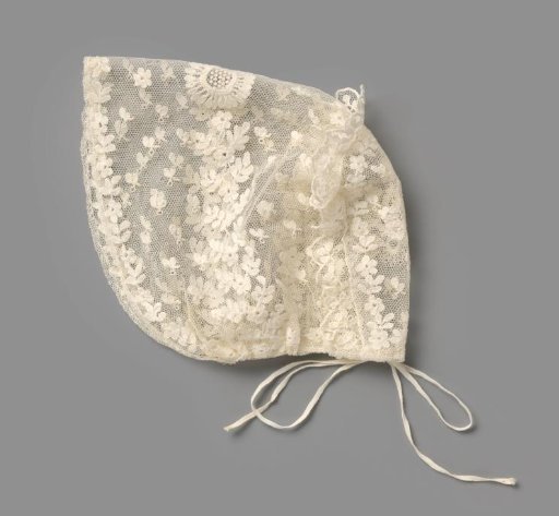 Child's Cap of Bobbin Lace with White Embroidered Leaves and Leaf Scrolls; on Top Pierced Flower Motif and at the Back Scalloped Festooned Edge with Leaf Motif