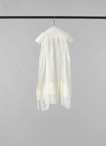 Baby shirt of linen, decorated with open hems, with shirring and without sleeves