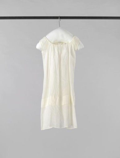 Baby shirt of linen, decorated with open hems, with shirring and without sleeves