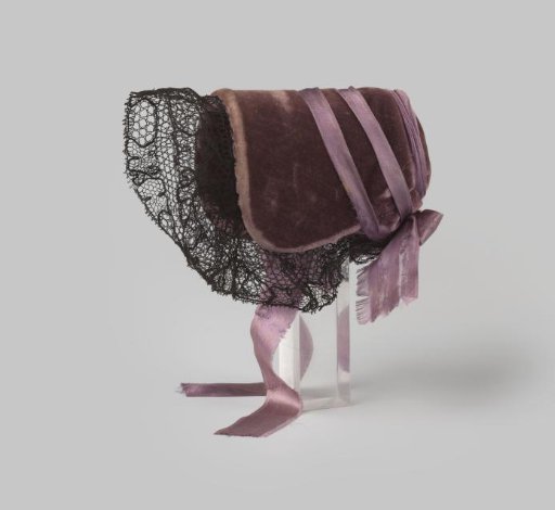 Bonnet of Dark Purple Velvet with a Strip of Black Parisian Lace and a Bow of Violet Satin Ribbon