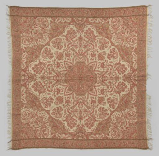Square shawl with a twelve-pointed red-green heart rosette in the center, surrounded by an all-over pattern of flower and leaf motifs on a natural ground